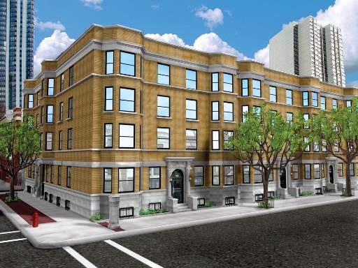 Front view of a multi-story building with brick facade and numerous windows.