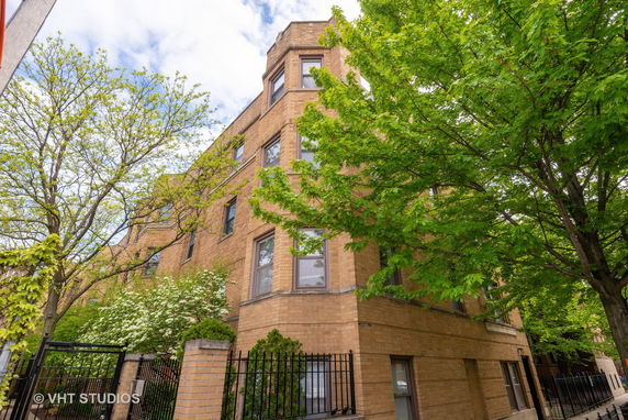 Front view of a multi-story brick building.