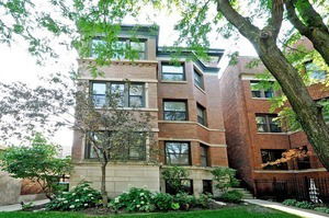 Front view of a multi-story brick building.