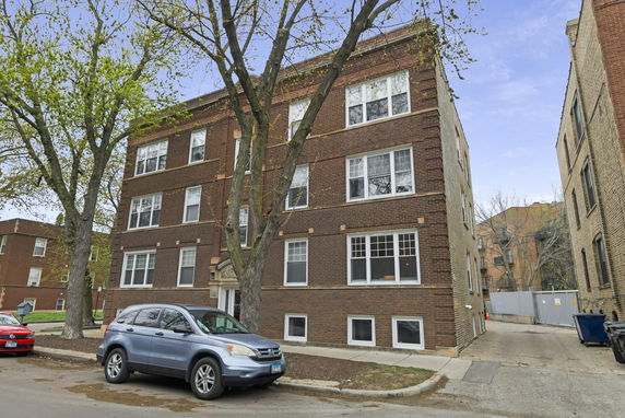 Front view of a three-story brick building.