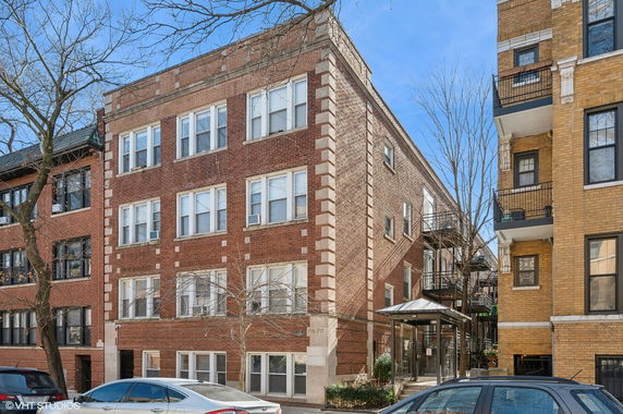 Front view of a multi-story brick building.
