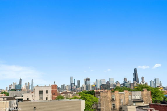 Panoramic view of a city skyline with various skyscrapers and buildings.