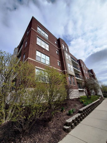 Front view of a multi-story brick building.