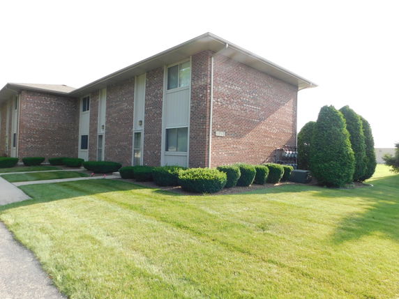 Front view of a two-story brick apartment building