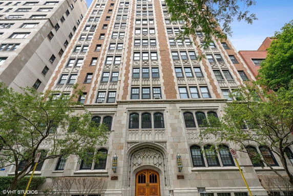 Front view of a multi-story building with ornate architectural details and windows.