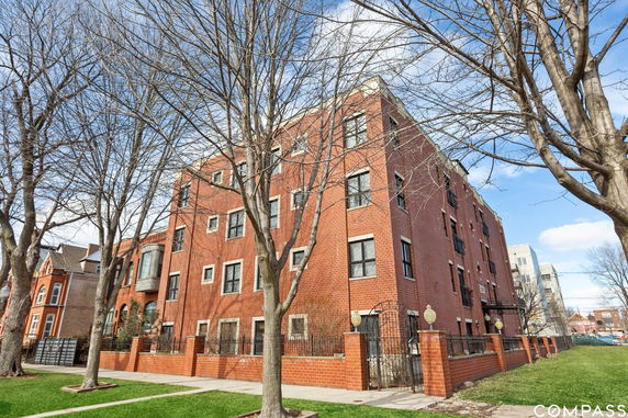 Front view of a multi-story brick building.