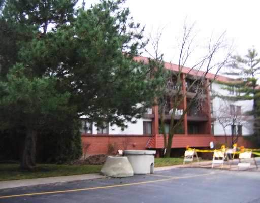 Front view of a multi-story building with balconies.