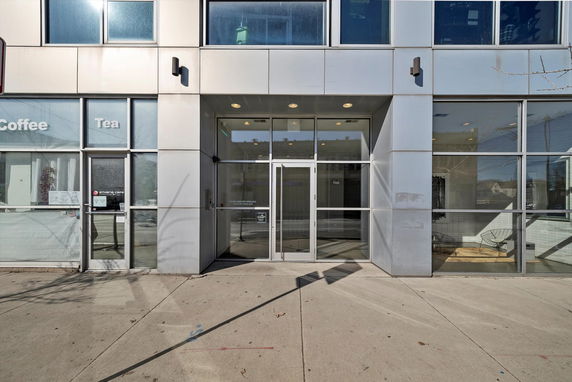 Front view of a building with glass and metal facade.