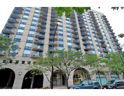 Front view of a multi-story residential building with multiple balconies.