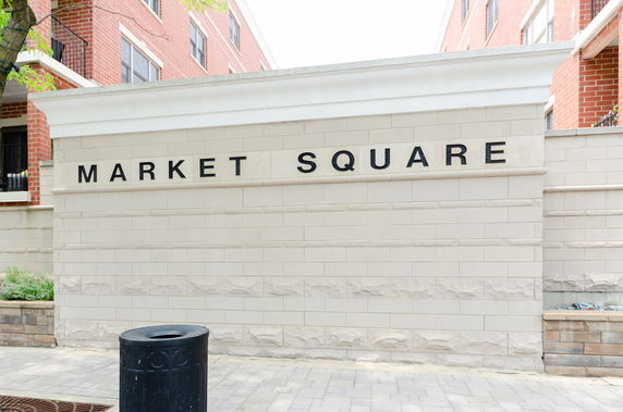 Front view of a building with a sign reading 'Market Square'.