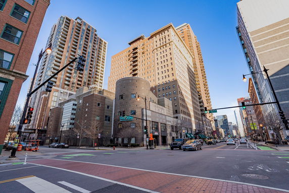 Front view of a high-rise building in an urban setting.