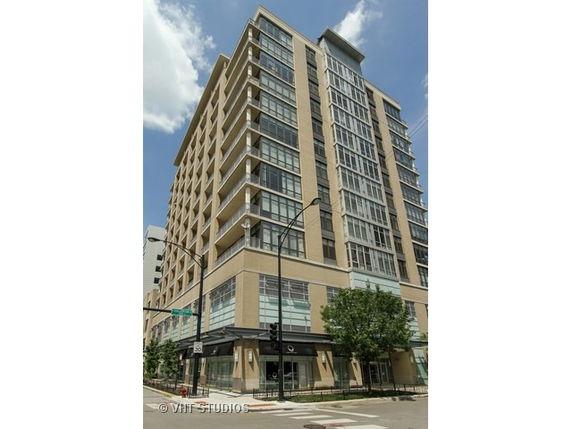 Front view of a multistory building with modern architectural design.