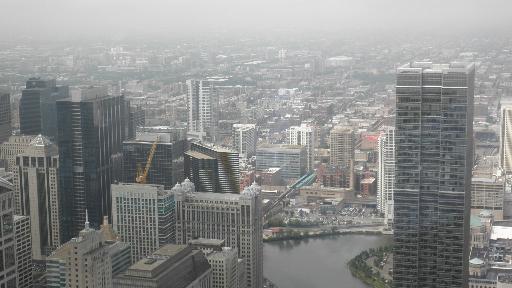 Panoramic view of urban skyline with multiple skyscrapers.