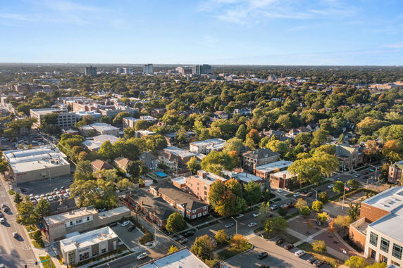 Panoramic view of a suburban area with numerous buildings and trees.