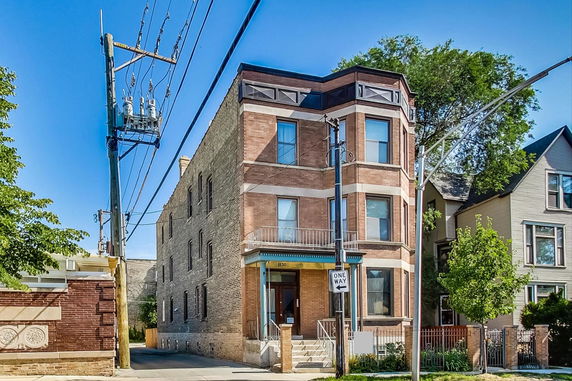 Front view of a three-story brick building.