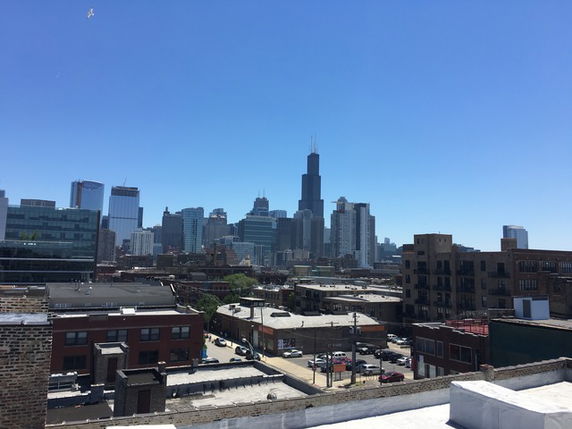 Panoramic view of a city skyline with tall buildings.