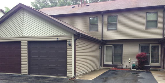 Front view of a two-story house with a double garage.