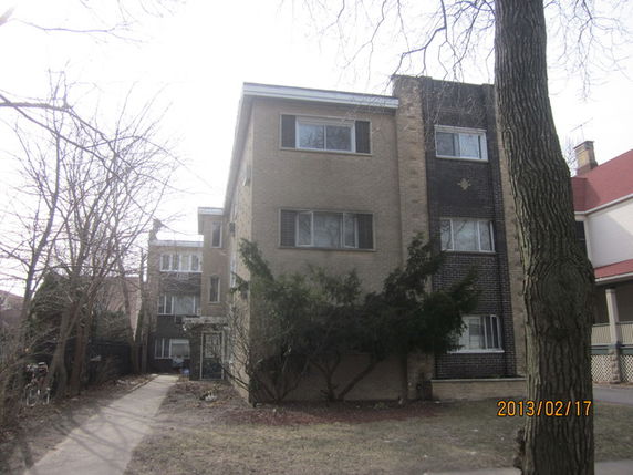 Front view of a multi-story apartment building.