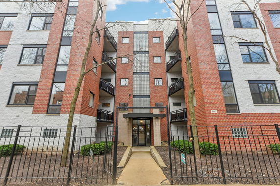 Front view of a multi-story apartment building.