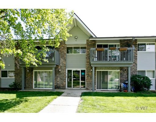 Front view of a multi-story apartment building with balconies.