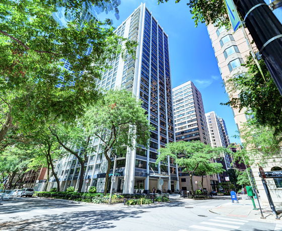 Front view of a modern high-rise building in an urban area.