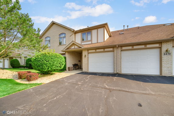 Front view of a two-story house with a double garage.