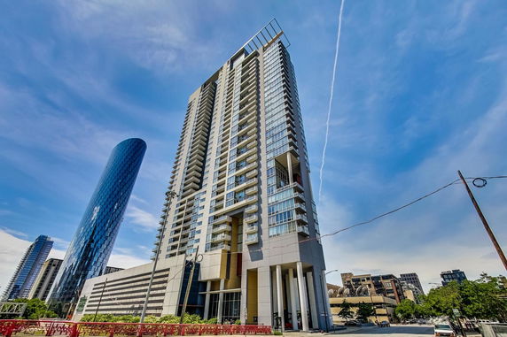 Front view of a modern high-rise building with a contemporary design.