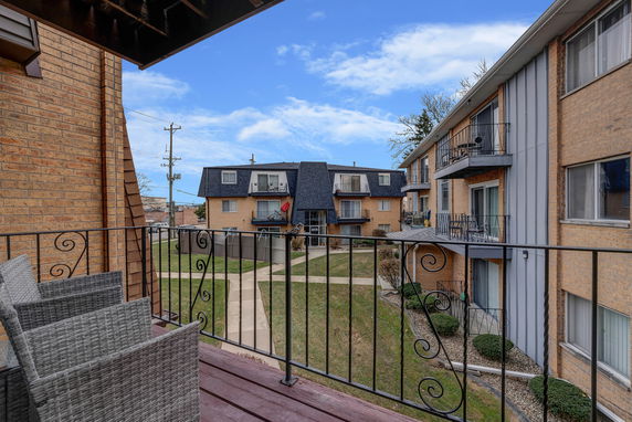Panoramic view of apartment buildings from a balcony.