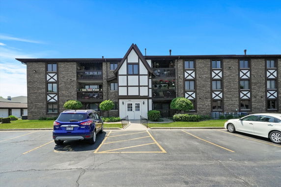 Front view of a multi-story building with a distinctive architectural design.
