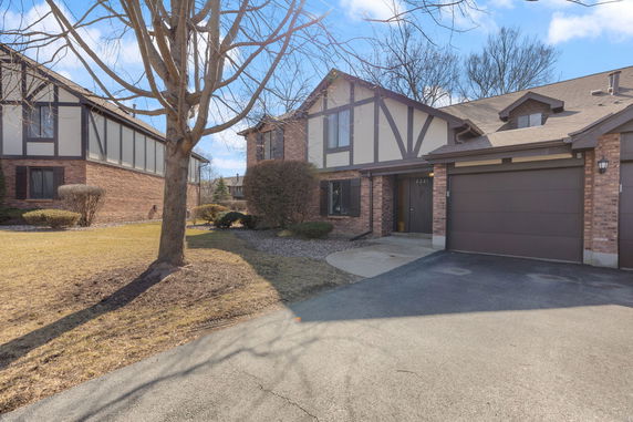 Front view of a two-story house with a double garage.