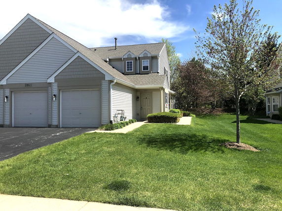 Front view of a two-story house with a double garage.