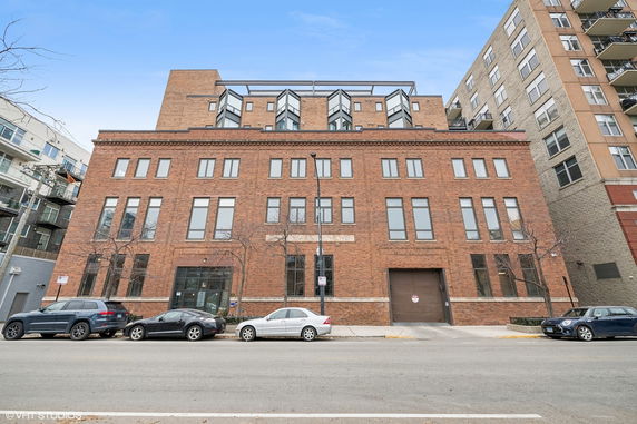 Front view of a multi-story brick building.