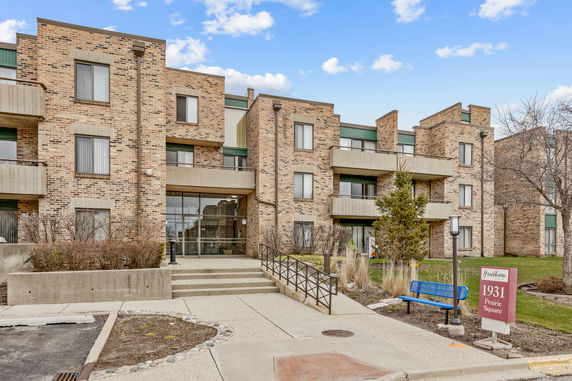 Front view of a multi-story brick residential building.