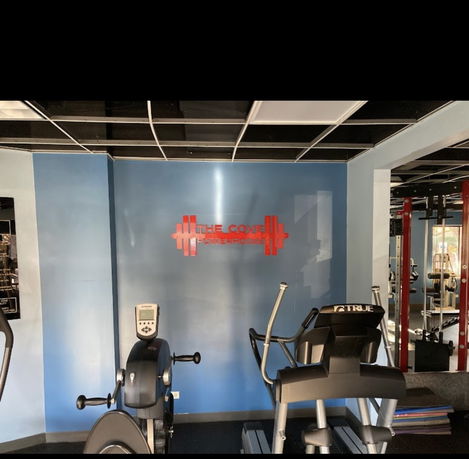 Interior view of a gym with exercise equipment.