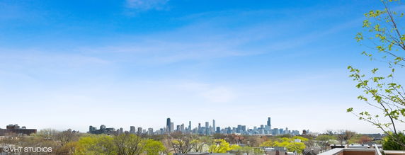 Panoramic view of a city skyline with tall buildings.