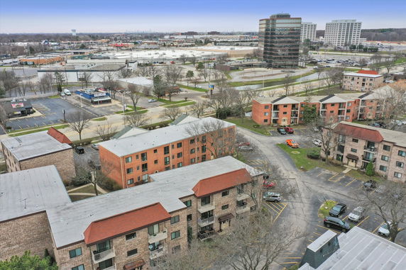 Panoramic view of residential apartment buildings with a nearby commercial area.