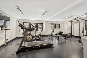 Indoor gym with various fitness equipment