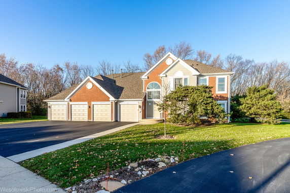 Front view of a two-story house with a triple garage.