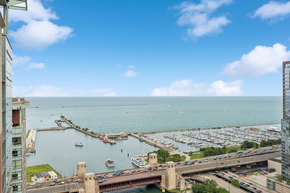 Panoramic view of a waterfront with docks and boats.