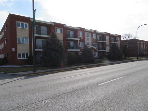 Front view of a multi-story apartment building.