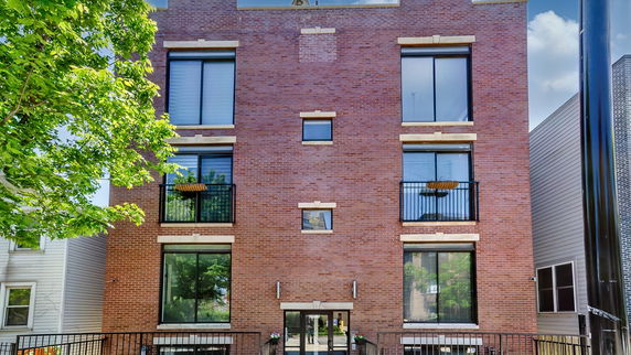 Front view of a multi-story brick building.
