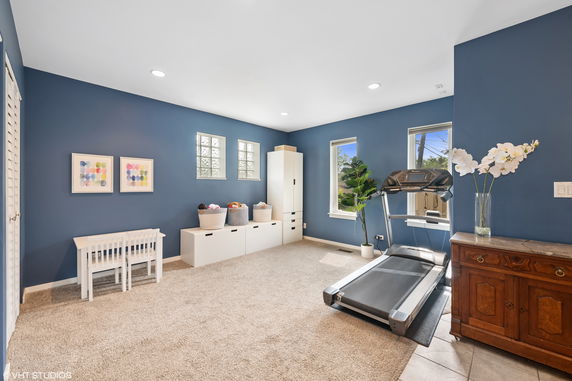 Indoor room with treadmill and play area