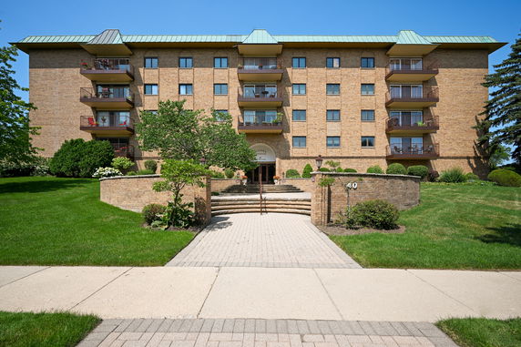 Front view of a multi-story building with balconies.