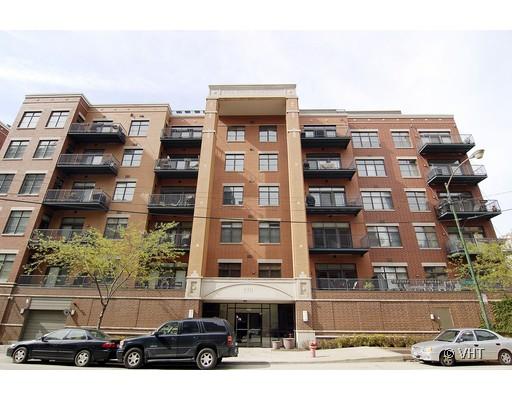 Front view of a multi-story residential building with balconies.