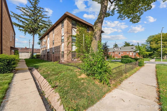 Front view of a multi-story brick building.