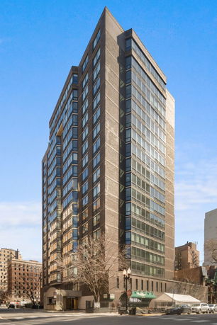 Front view of a high-rise building with a modern glass and brick facade.