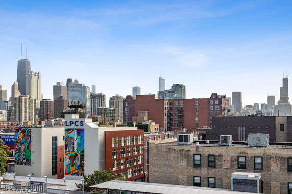 Panoramic view of a city skyline with various buildings.