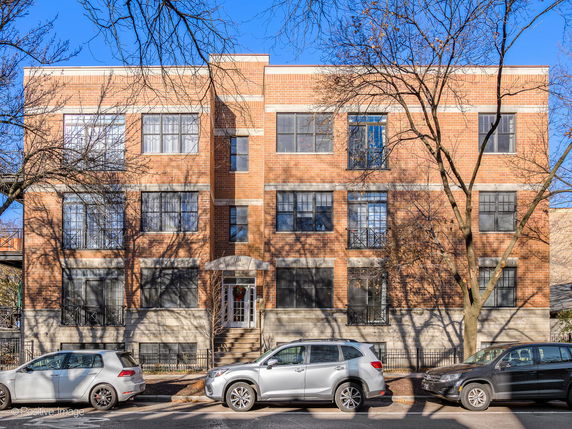 Front view of a brick exterior multi-story building.