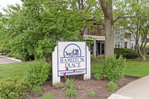 Front view of a residential building with a sign indicating Hamilton Place.