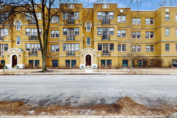 Front view of a multi-story residential building with a classic facade.